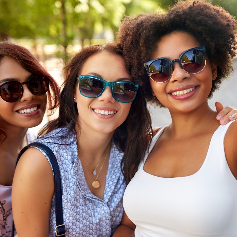 Three friends sharing a sunny afternoon together